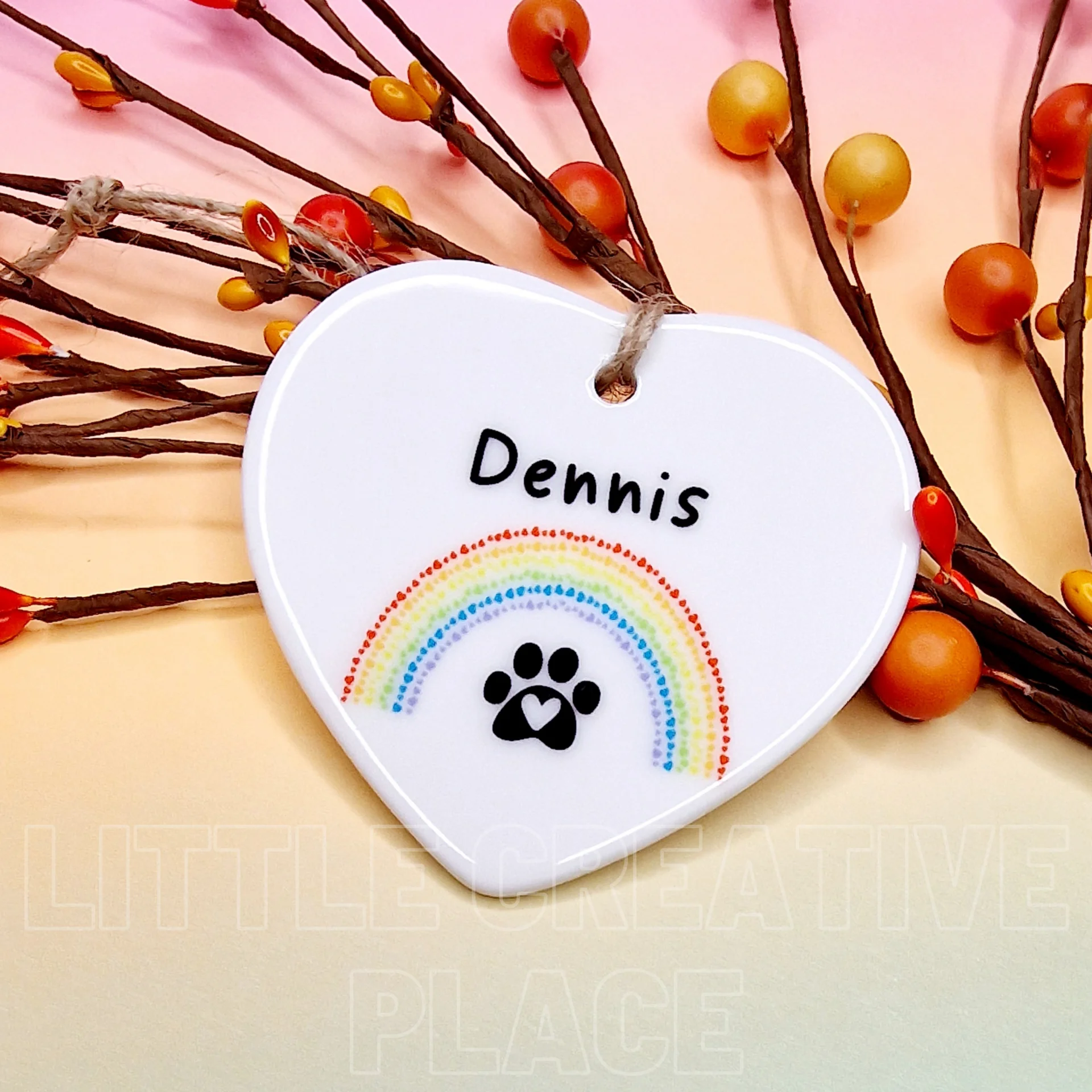 Personalised pet memorial ceramic heart with rainbow paw print design