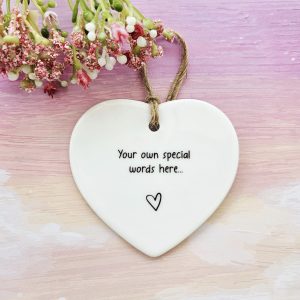 Personalised ceramic heart keepsake with custom message and natural twine hanging loop