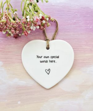 Personalised ceramic heart keepsake with custom message and natural twine hanging loop