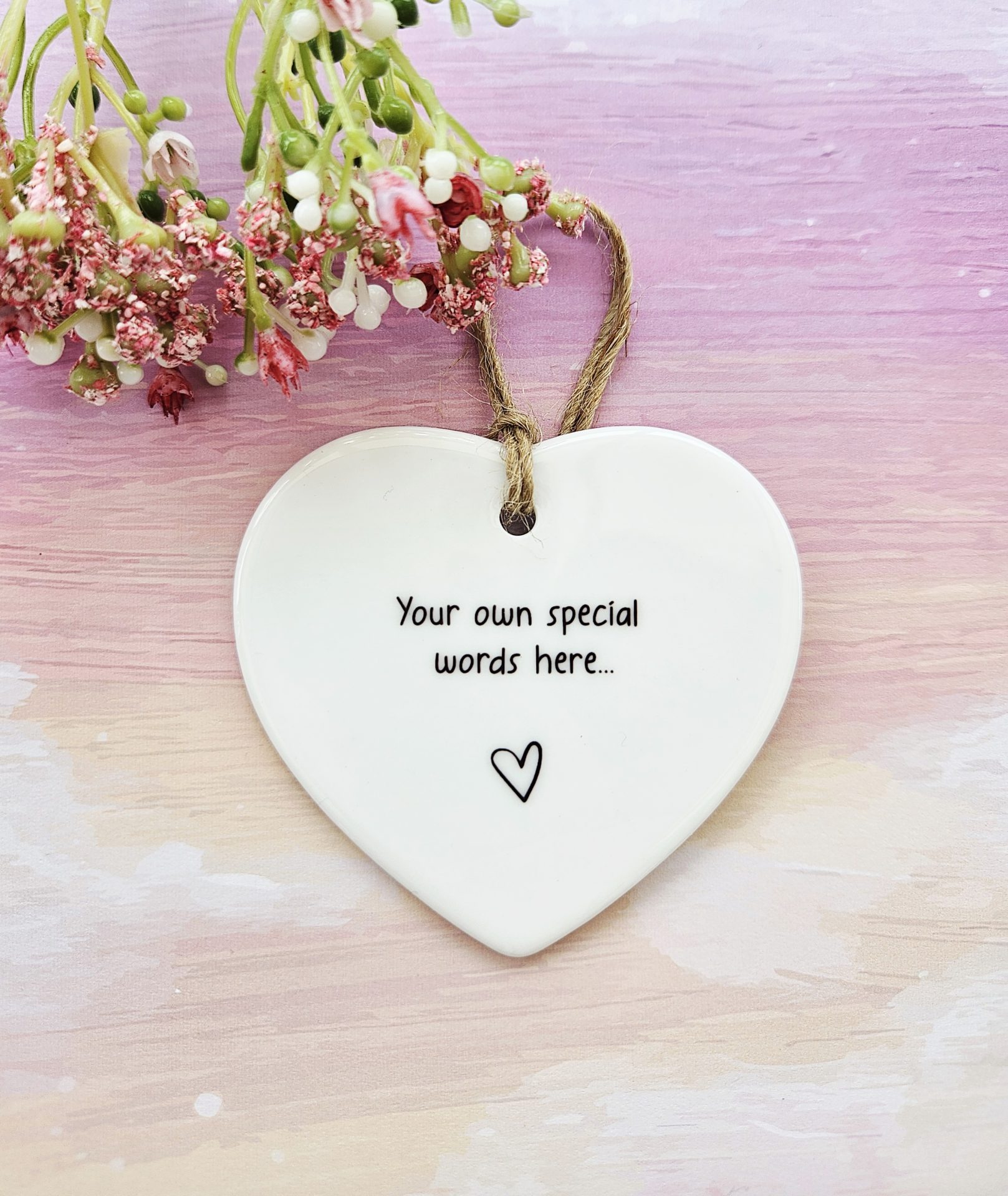 Personalised ceramic heart keepsake with custom message and natural twine hanging loop