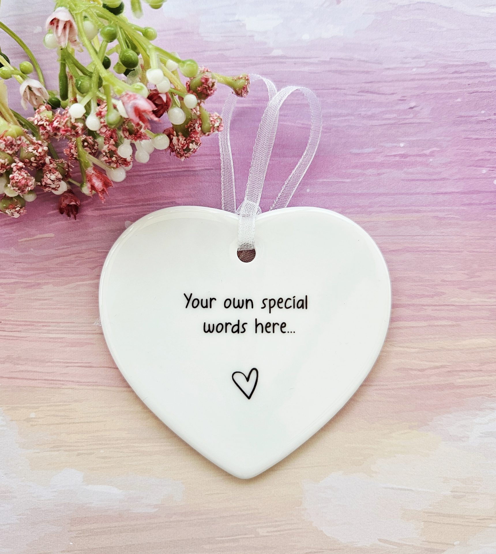 Personalised ceramic heart keepsake with custom wording and white organza ribbon hanger