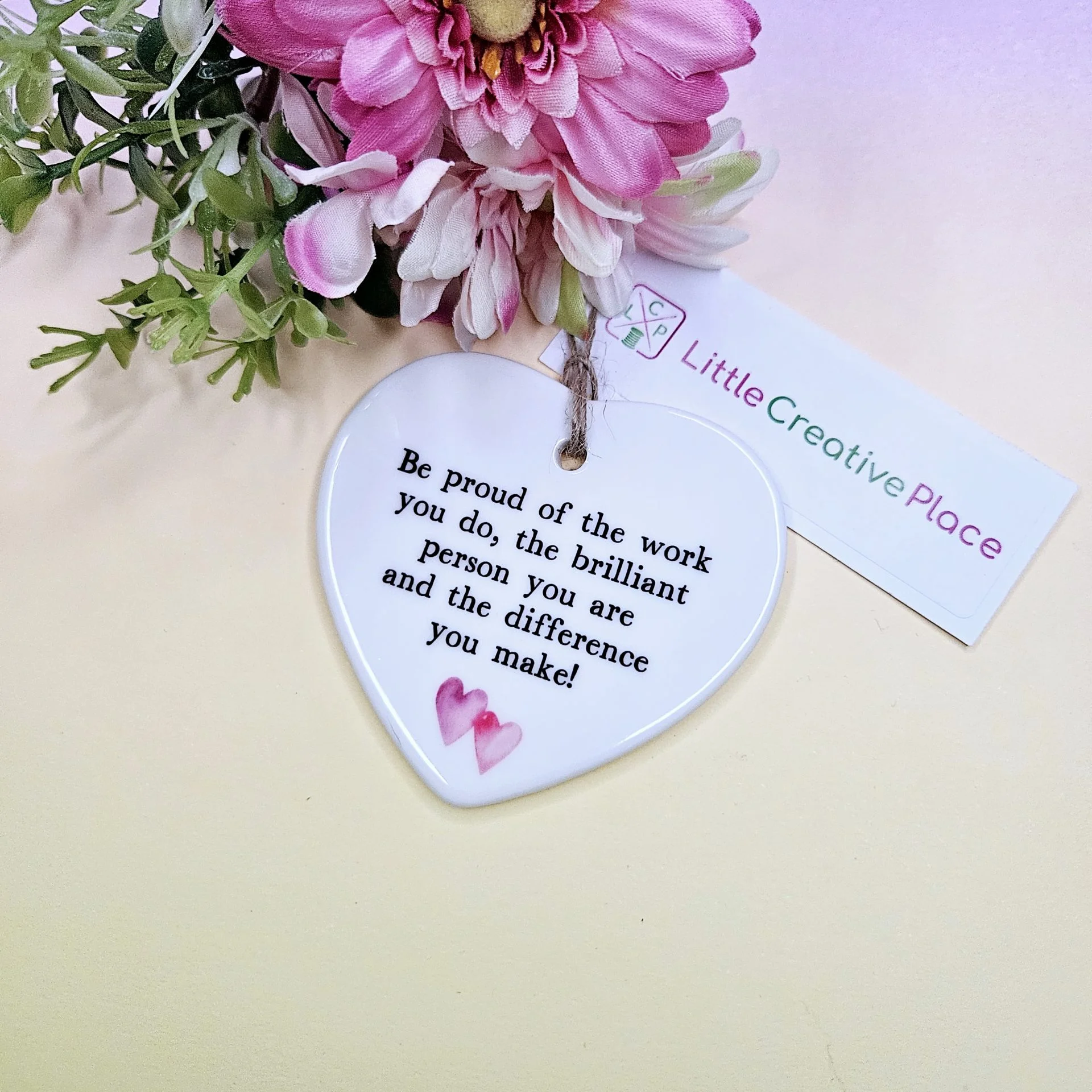 Personalised heart keepsake with “Be Proud of the Work You Do” quote on ceramic hanging heart