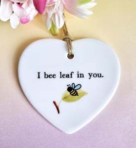 Bee encouragement gift ceramic heart keepsake with the words "I Bee-leaf In You"