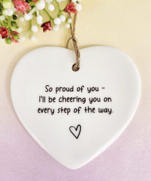 Ceramic heart keepsake displaying the quote ‘So proud of you – I’ll be cheering you on every step of the way’.