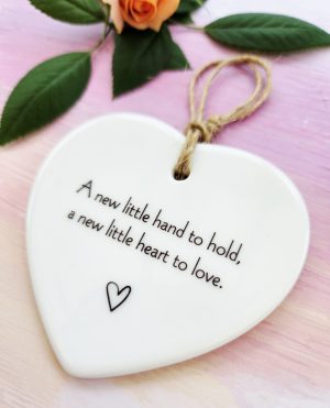 a new little hand to hold christening gift close up