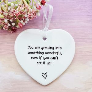 encouragement ceramic heart with inspirational message and white ribbon