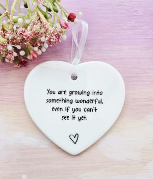 encouragement ceramic heart with inspirational message and white ribbon