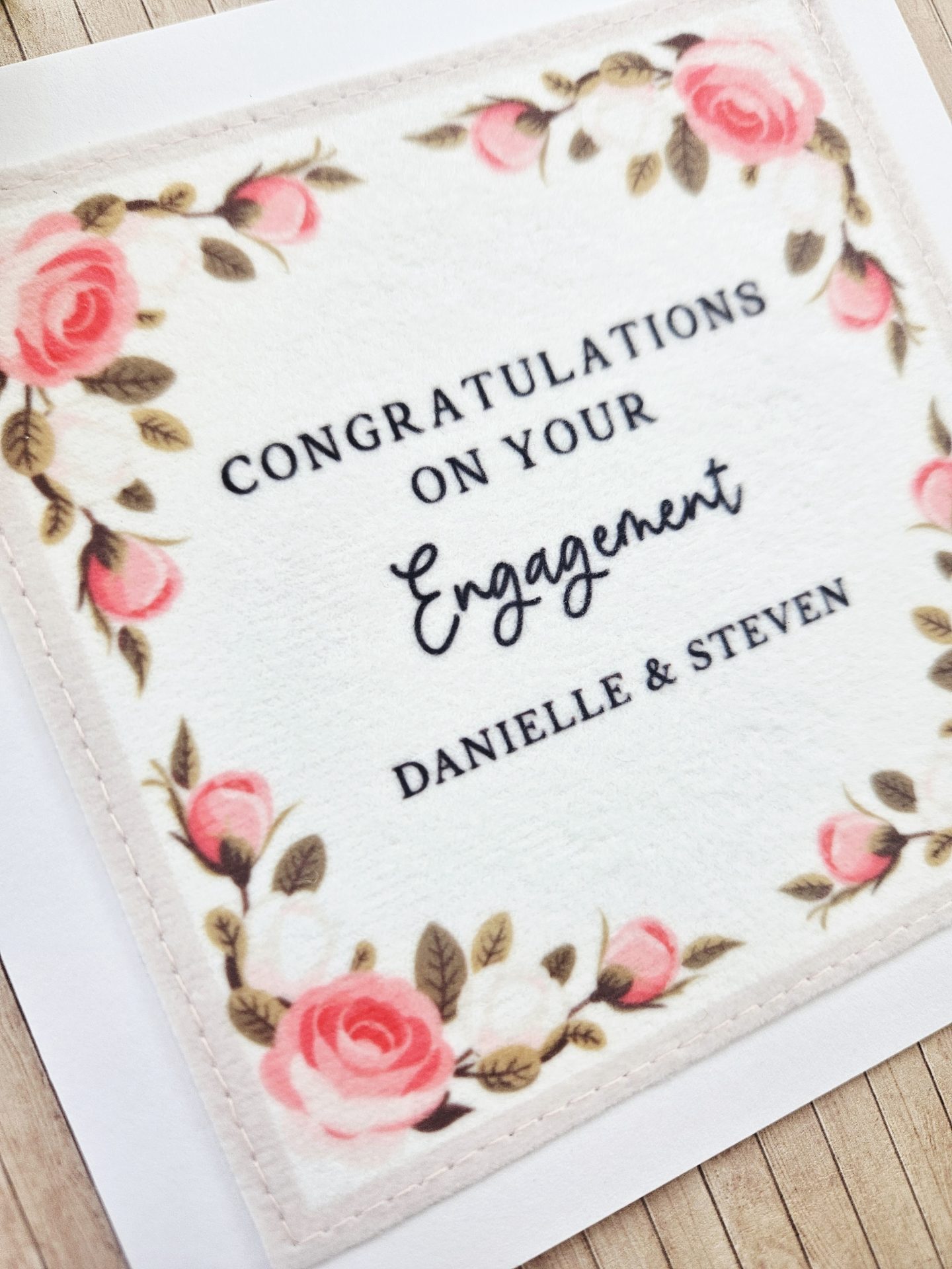 Detail of congratulations on your engagement card with pink rose design