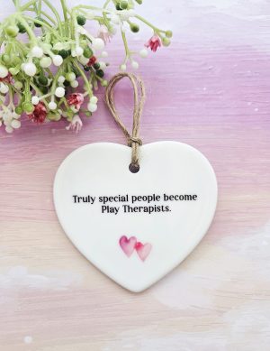 Play therapist gift ceramic hanging heart with “Truly special people become Play Therapists” quote and pink heart detail