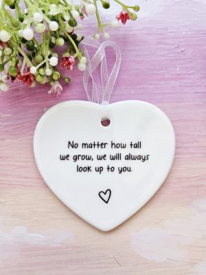 ceramic parent heart ornament with meaningful quote for mum or dad hanging on pink background