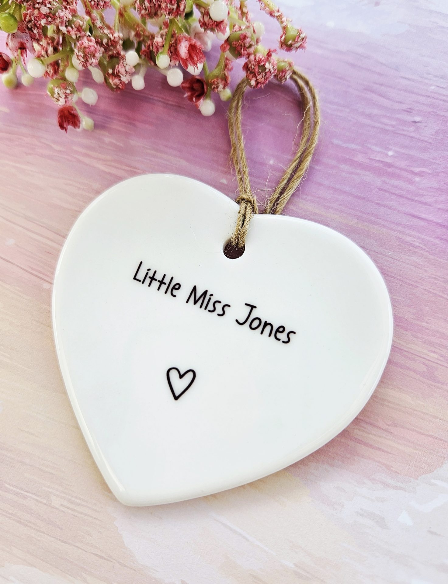 personalised baby girl ceramic heart name detail close up