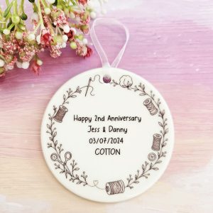 Personalised 2nd wedding anniversary gift round ceramic ornament with cotton wreath detail for Jess & Danny