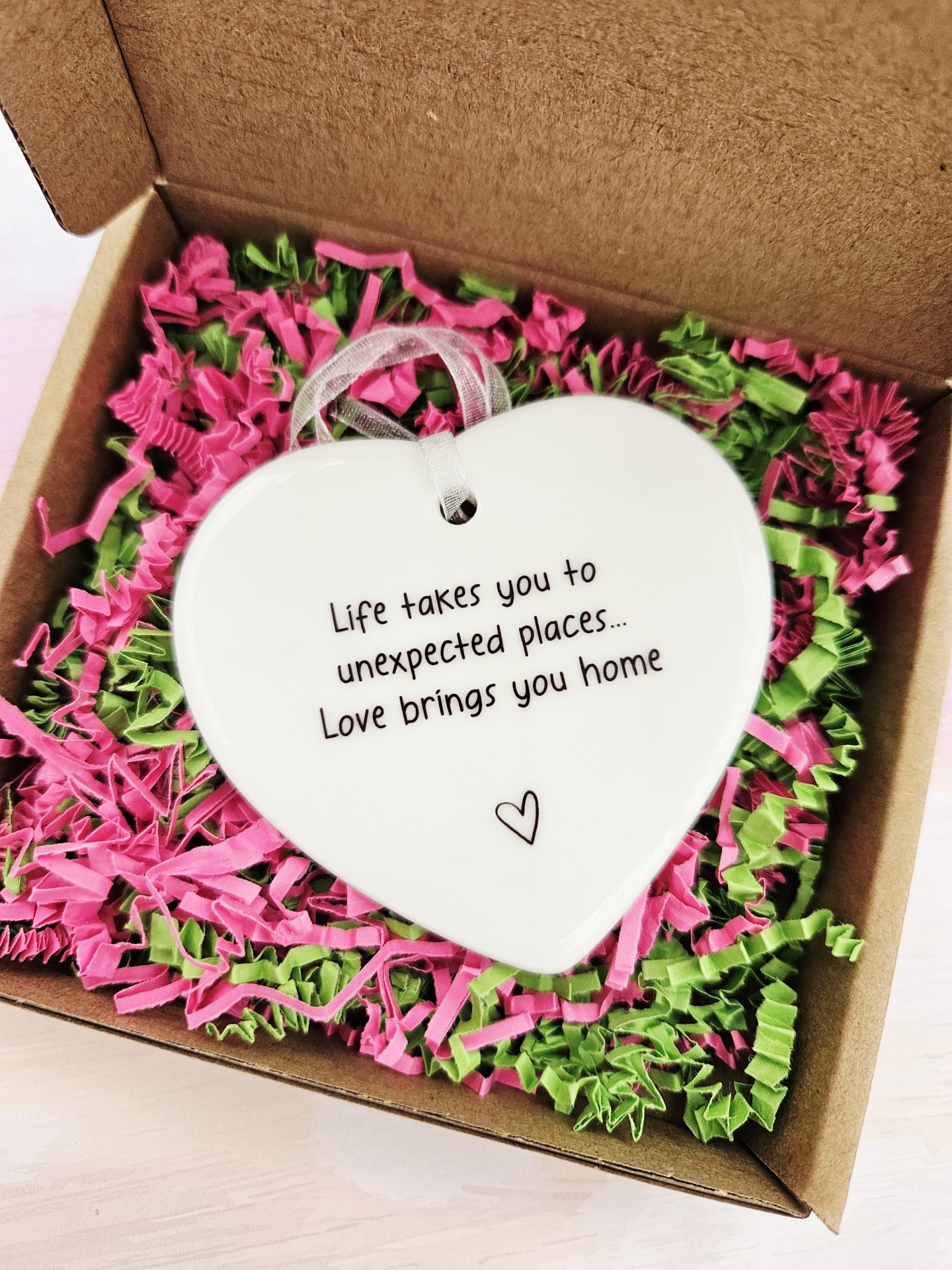Ceramic heart keepsake gift box with signature pink and green shredded paper