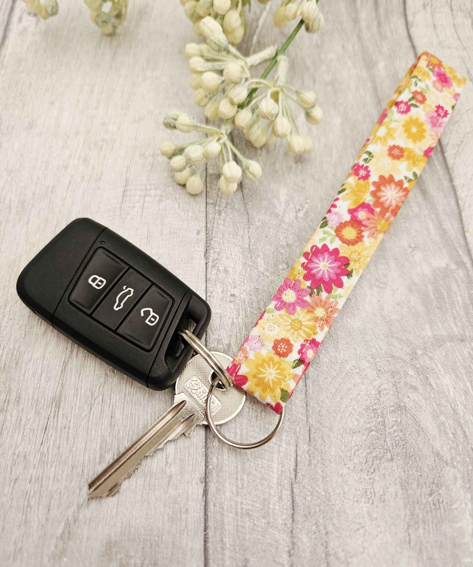 Floral fabric wristlet presented as a handmade gift