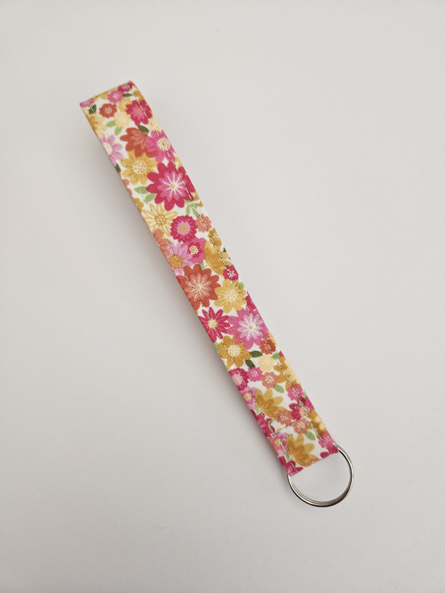 Handmade floral fabric wristlet with silver metal keyring
