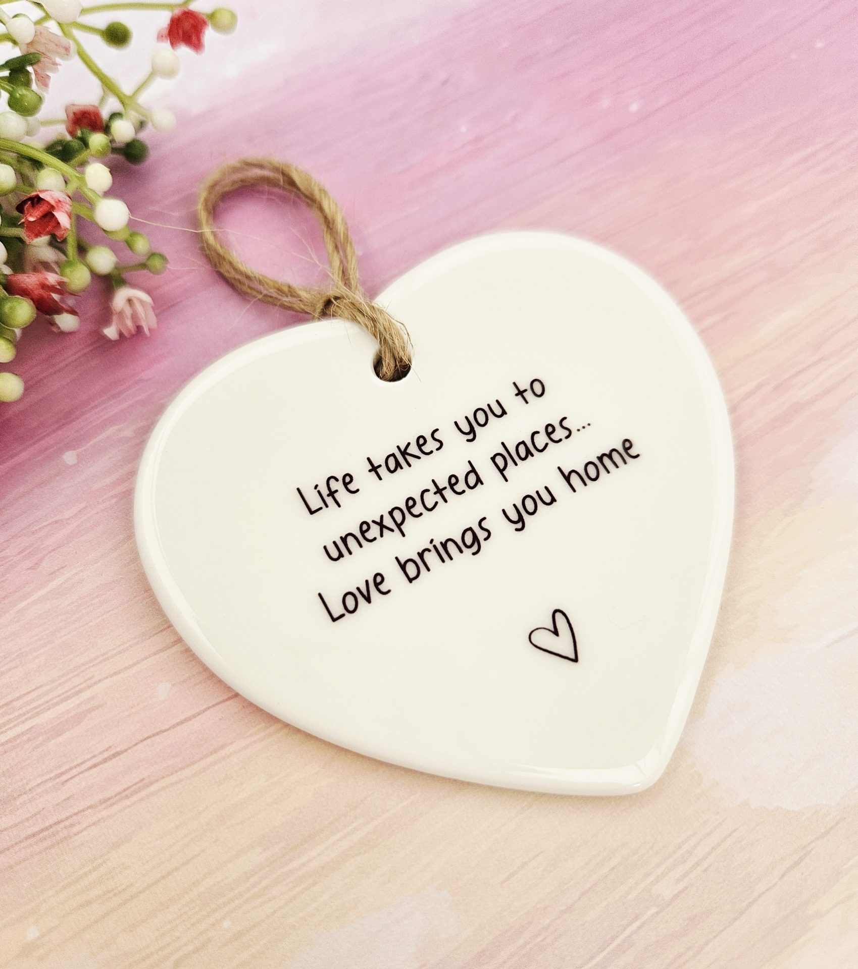 Handmade ceramic heart keepsake featuring the quote life takes you to unexpected places love brings you home