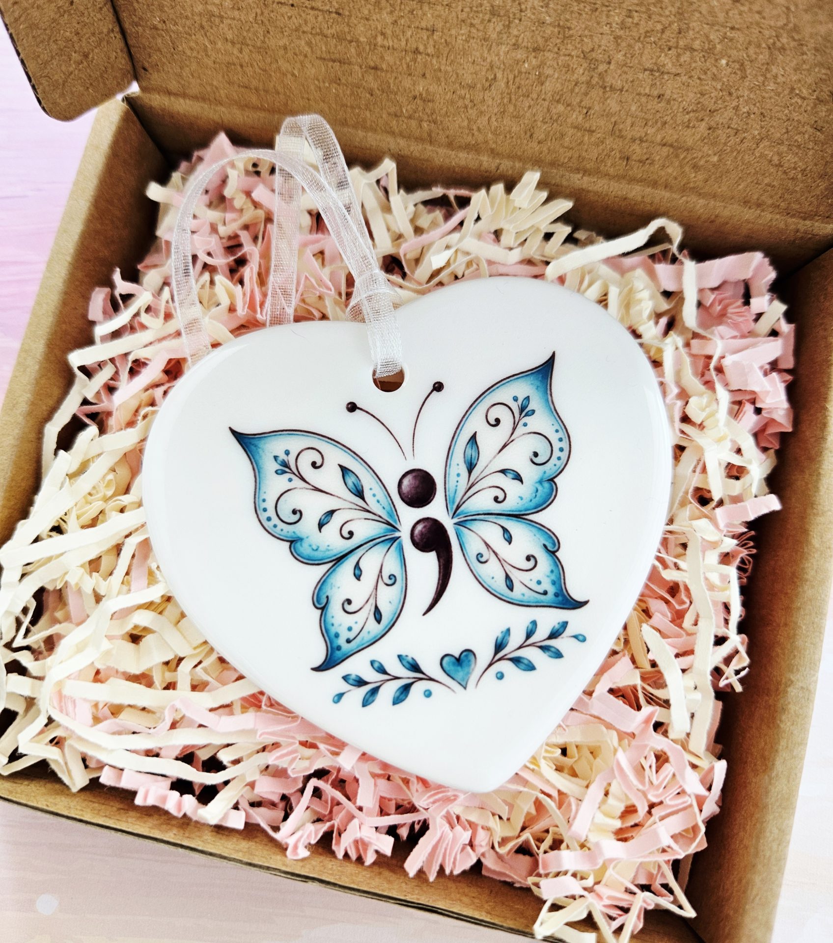Semicolon Butterfly Ceramic Heart presented in a gift box with soft pink and cream shredded paper