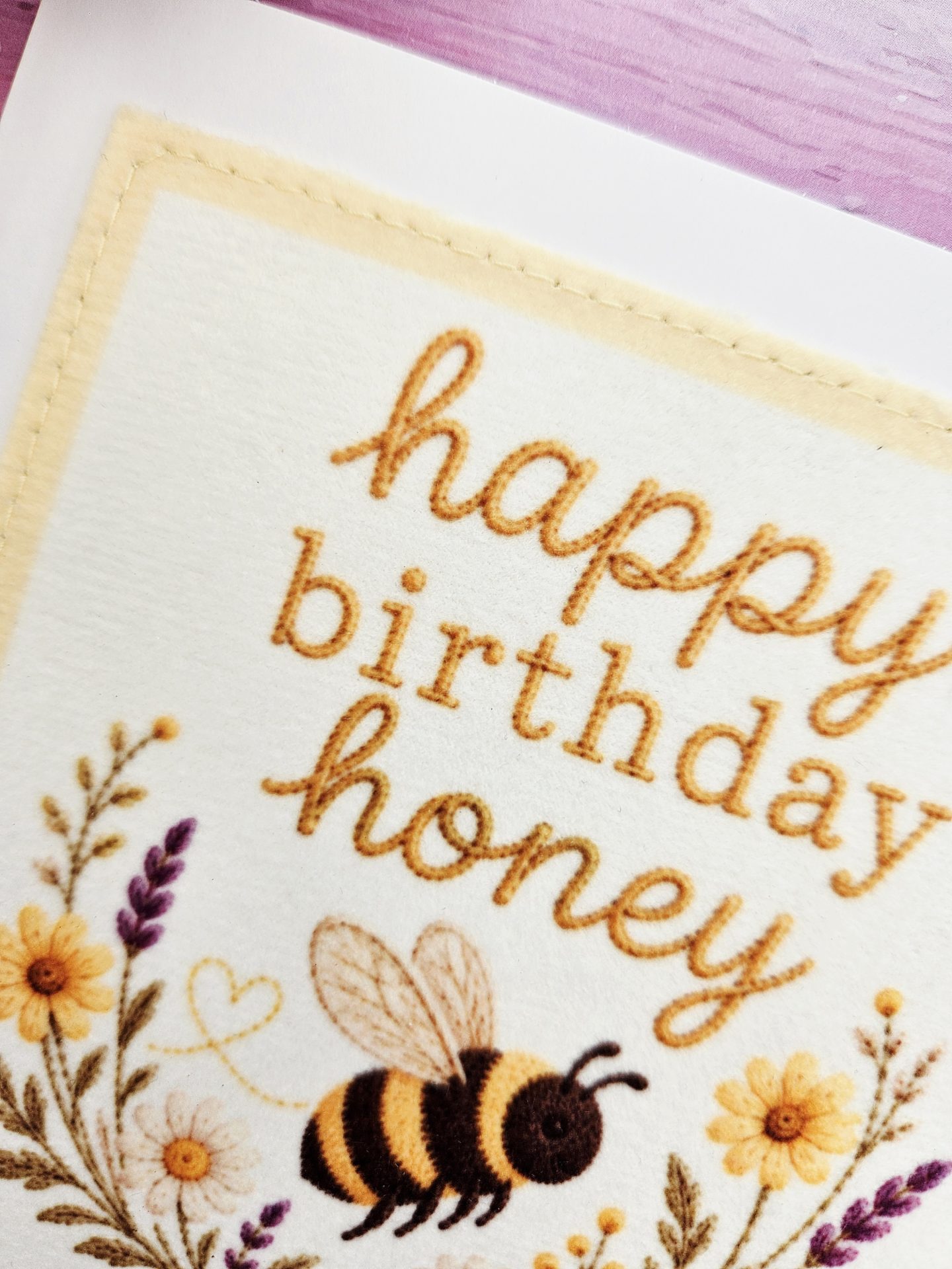 Fabric detail of handmade bee birthday greeting card