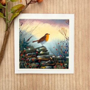 Handmade robin greeting card featuring a stitched fabric countryside design.