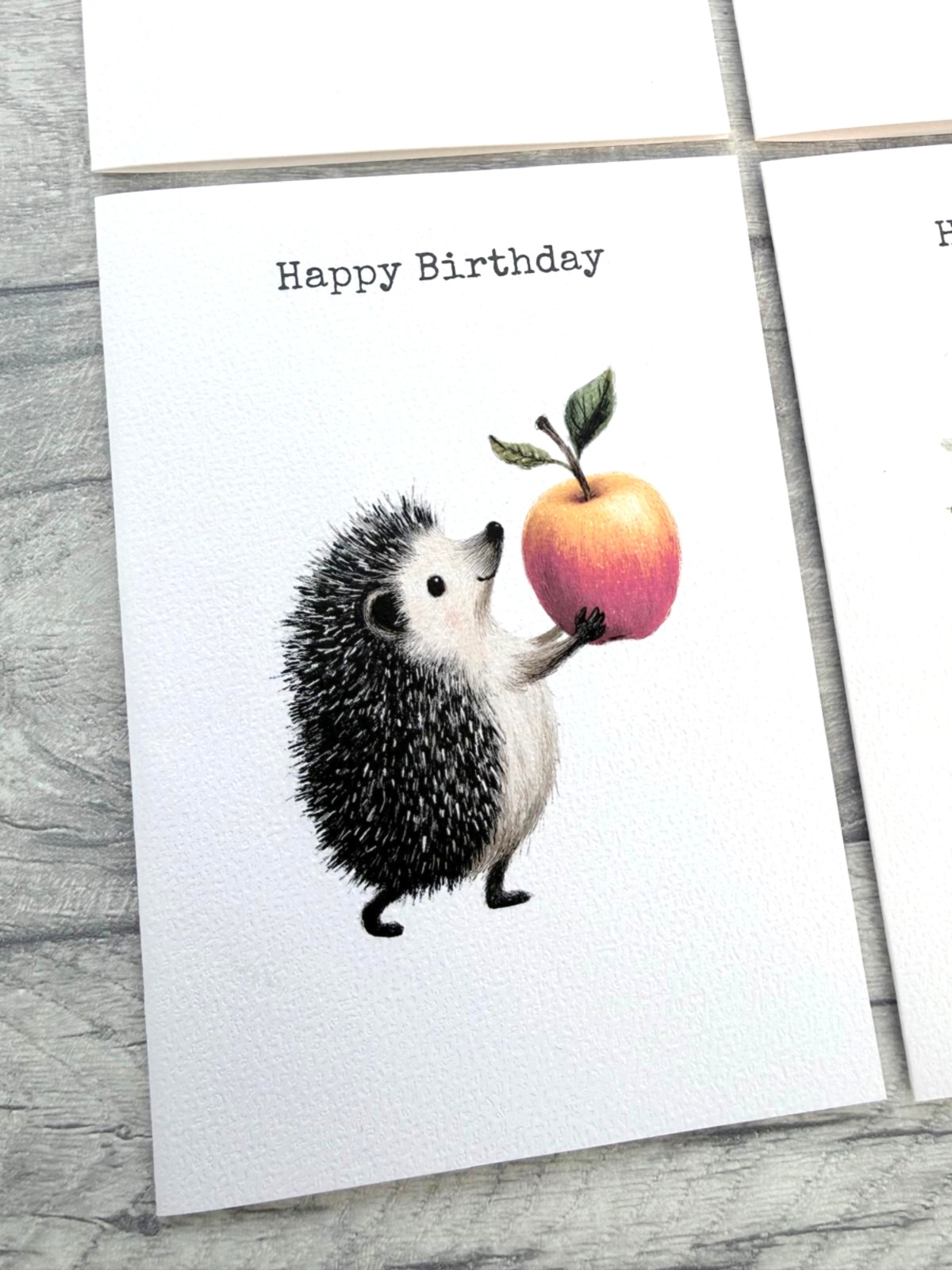 Woodland hedgehog birthday card featuring a hedgehog holding a colourful apple