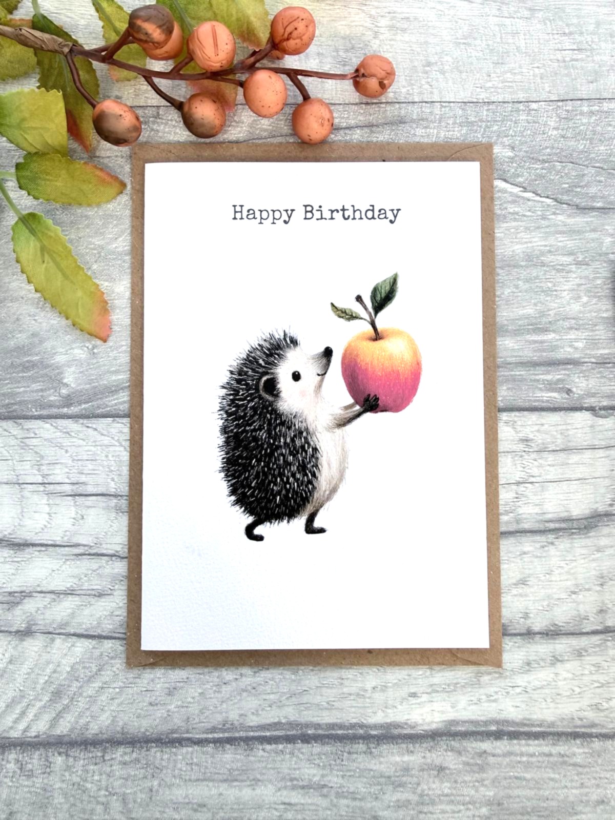 A6 woodland hedgehog birthday card with apple illustration and kraft brown envelope