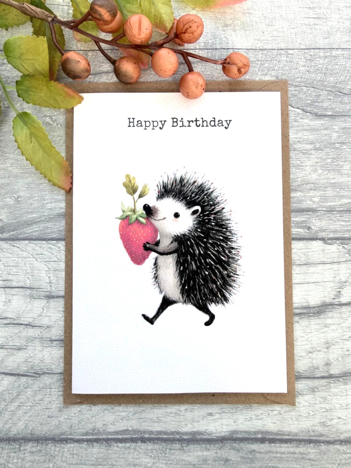 Whimsical hedgehog birthday card with strawberry illustration and kraft brown envelope