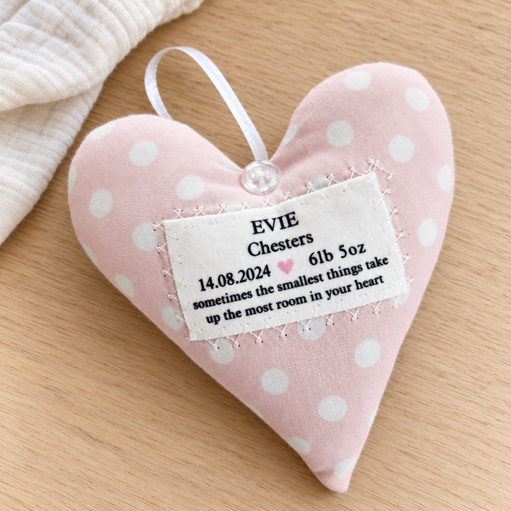 Personalised new baby girl fabric heart keepsake in pink polka dot cotton, featuring baby's name and birth details, handmade in Wales.