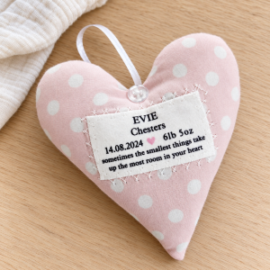 Personalised baby girl gift, handmade pink polka dot fabric hanging heart with baby's name and birth details, a beautiful newborn keepsake and nursery decoration.