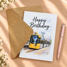 Manchester tram birthday greeting card with natural kraft envelope, featuring a yellow tram illustration, a thoughtful gift for tram lovers.