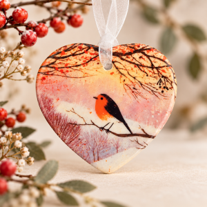 Robin ceramic heart hanging ornament with white organza ribbon, featuring a pink woodland landscape, a thoughtful nature-inspired gift.